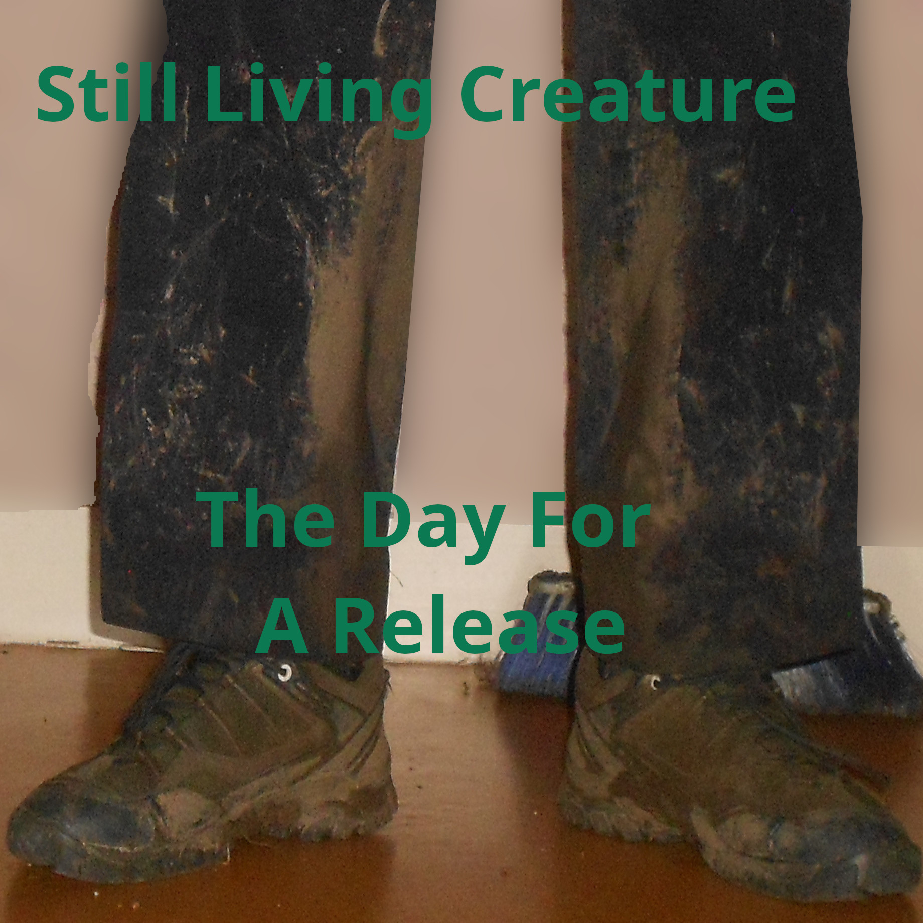Still Living Creature - The Day For A Release printed over a square photography of the legs in a trouser covered by mud stains of someone in a room also wearing mud covered hiking shoes